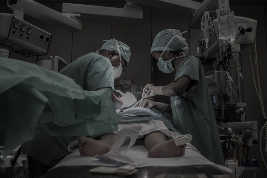 Surgeons operate on a patient