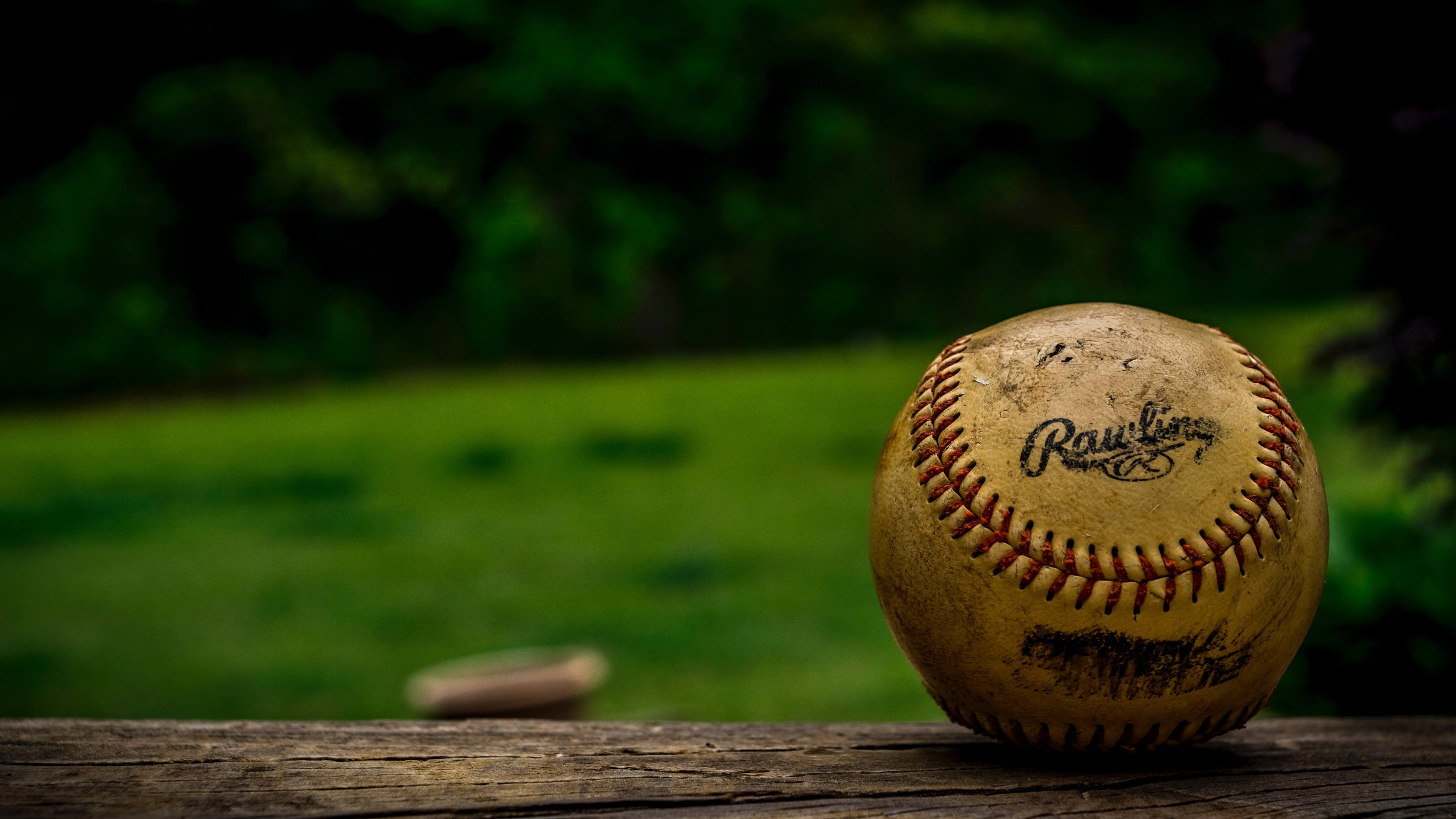 baseball on wooden bench